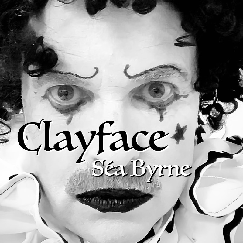 Close up as Séa Byrne dresed as Pagliacci the clown looking serious