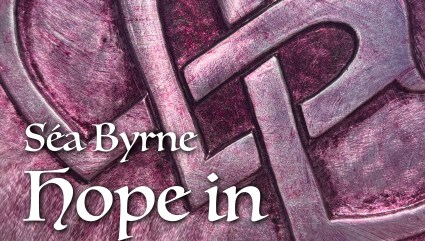 A metallic heart embossed in red wine tones, with a treble clef integrated into the Celtic-styled design.