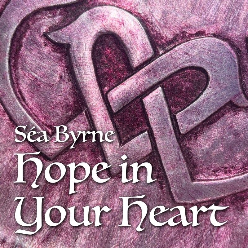 A heart embossed in metal. Painted Red Wine. The heart is formed from a Celtic knot pattern.